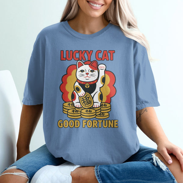 Blue t-shirt with a lucky cat and coins graphic.