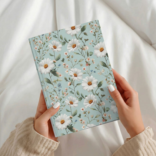 A5 grandmacore journal, sage-blue cover with white daisies and wildflowers"