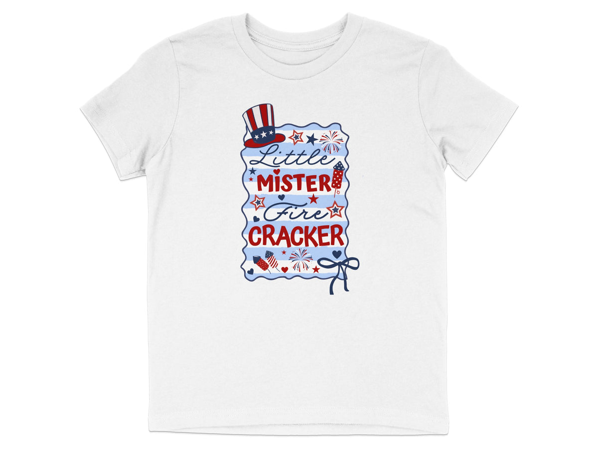 White t-shirt with "Little Mister Firecracker" text and patriotic graphics.