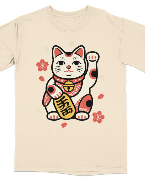 Maneki-neko waving lucky cat charm with cherry blossoms on a cream t-shirt.