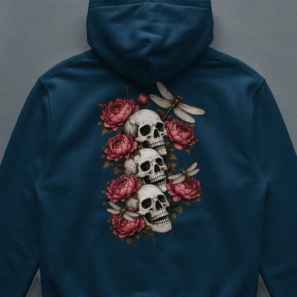 Three skulls stacked with peonies and dragonflies on a dark blue hoodie. French Navy