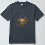 A dark charcoal gray short-sleeve t-shirt with a metallic gold ladybug graphic and small stars and crescent moon on the front, displayed flat against a light gray background.