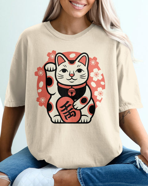 Cream t-shirt with a round Japanese Maneki-neko cat design and cherry blossoms.
