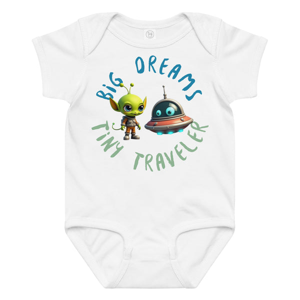 White baby onesie with a cute alien and spaceship illustration and the phrase "Big Dreams Tiny Traveler" in playful font