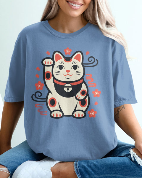 Blue t-shirt with a Maneki-neko cat graphic and floral accents.