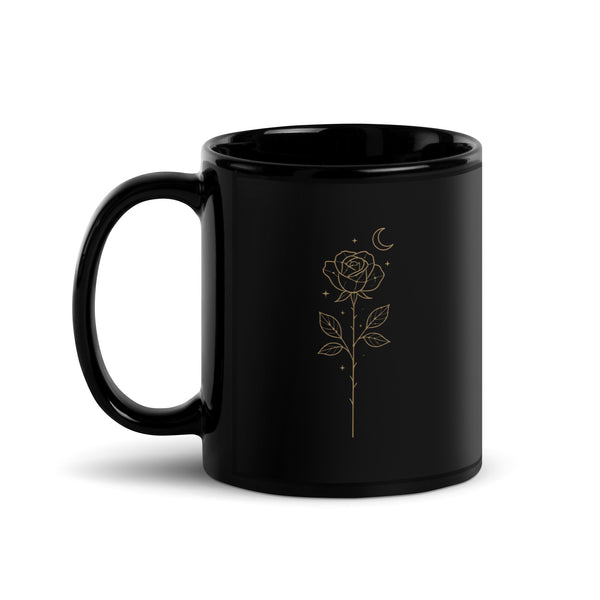 Black ceramic mug with a golden Starlit  Rose design printed three times around the surface. Left handle view of the 11 oz size.
