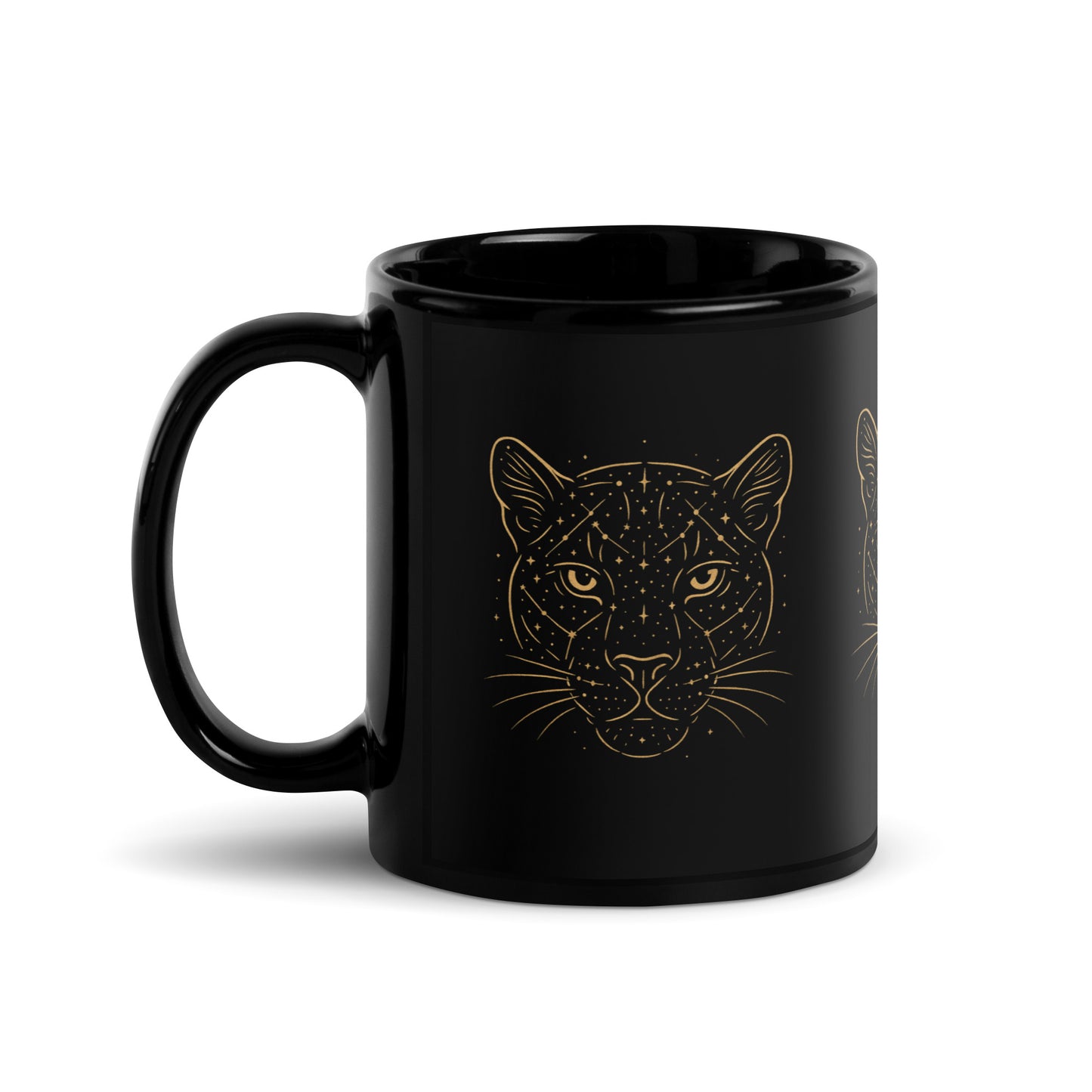 Close-up of the golden Constellations Big Cat design on a black ceramic mug. Left side handle.