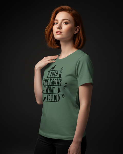 Woman wearing a green t-shirt with the "I told the crows' text on a black background