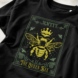 Black t-shirt with yellow bee design and text on a plain background 