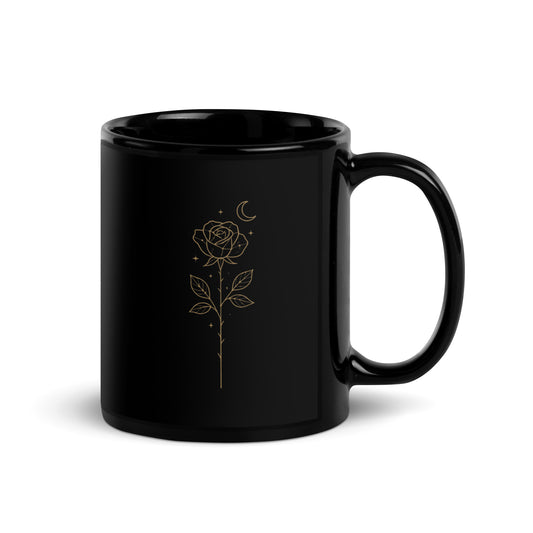 Black ceramic mug with a golden Starlit  Rose design printed three times around the surface.