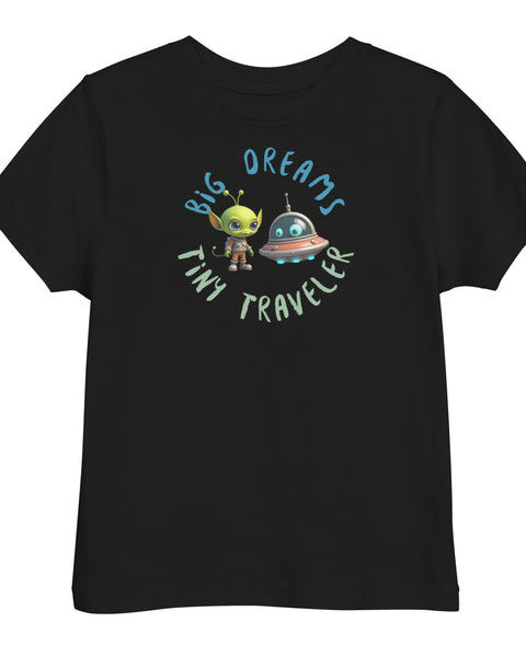 Black toddler t-shirt featuring a green alien and spaceship with the phrase "Big Dreams Tiny Traveler" in playful lettering