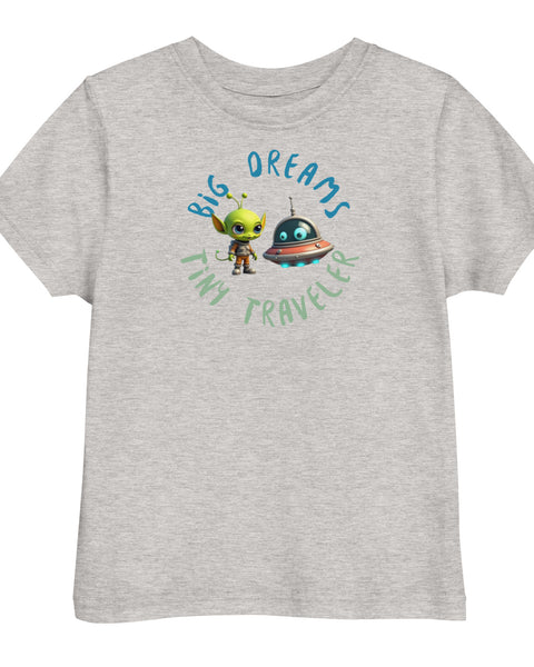 Heather toddler t-shirt featuring a green alien and spaceship with the phrase "Big Dreams Tiny Traveler" in playful lettering