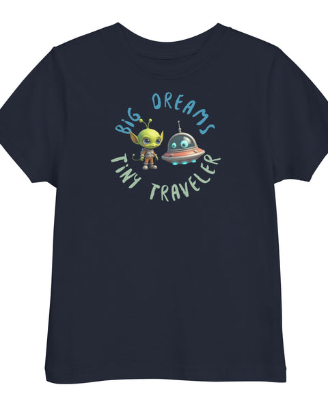 Navy toddler t-shirt featuring a green alien and spaceship with the phrase "Big Dreams Tiny Traveler" in playful lettering
