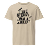 Beige t-shirt with black text and crow illustrations on a white background