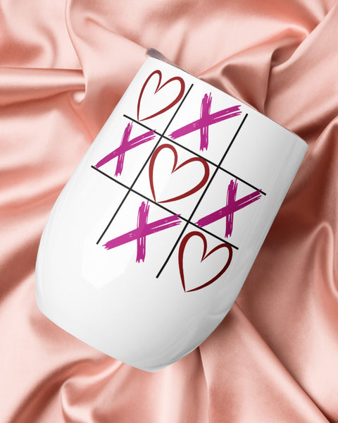 XOXO wine tumbler on satin fabric